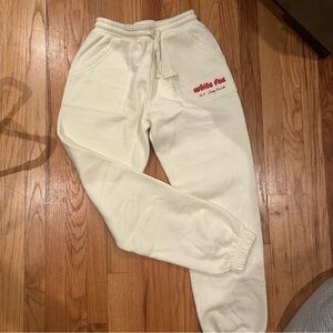 White Fox Boutique Cream Sweatpants with Red Logo